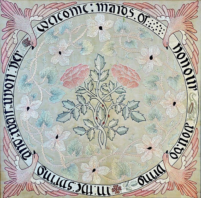 Maids of honour May Morris screen panel design with blues and pinks and a circular border of writing