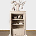 Irish artist Daphne Wright's Fridge a cast clay sculpture showing the inside of a fridge and featuring a vase of dying flowers on the top