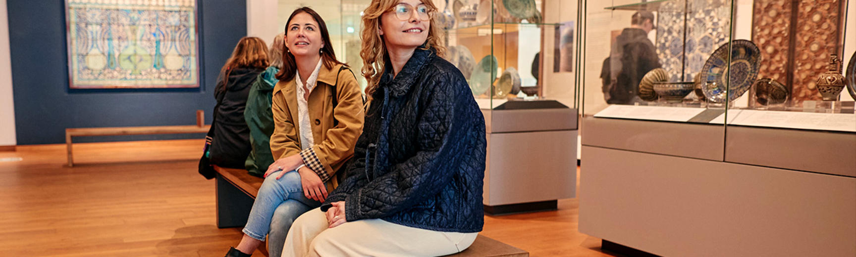Visitors on the seats in the Islamic Middle East Gallery