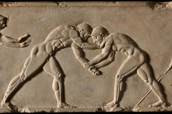 Plaster cast of an ancient Greek relief showing two men wresling