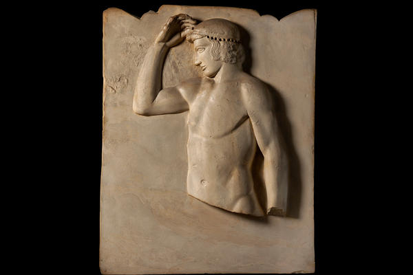 Plaster cast of an ancient Greek relief showing a victorious athlete in profile