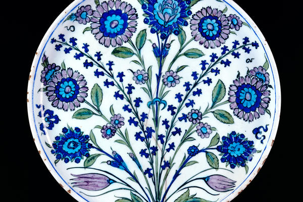 Colourful patterned dish decorated with stylised flowers
