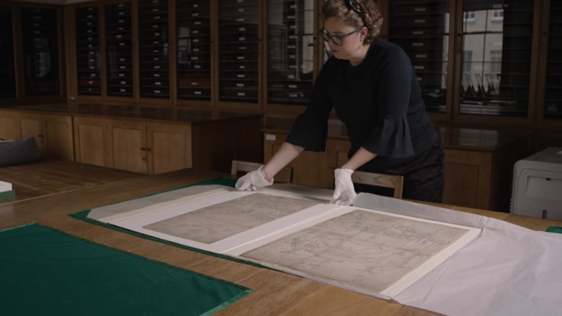 A curator handles artworks in the Ashmolean's Western Art Print Room