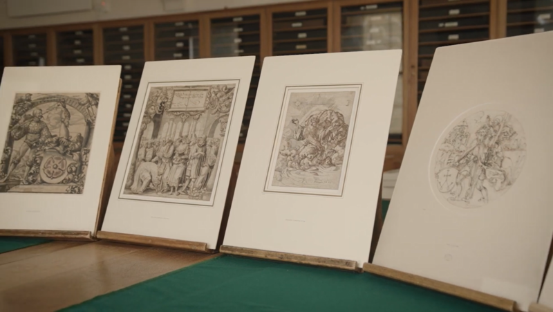 Four artworks propped up on a table in the Ashmolean's Western Art Print Room