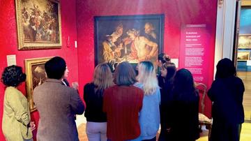 Krasis students examining Matthias Stom's 'Blowing Hot Blowing Cold' in Gallery 46; LI2640.1