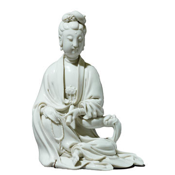 White ceramic figurine of a figure